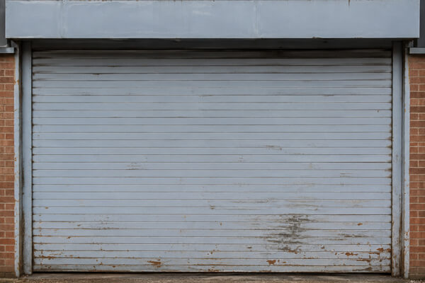 Commercial roller shutter door before painting in Daventry