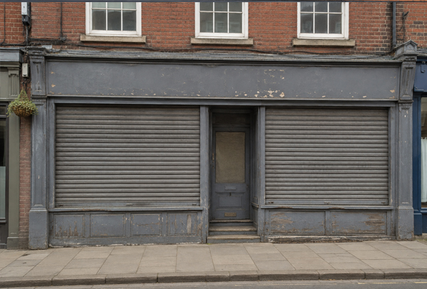 Shop roller shutter before painting in Daventry