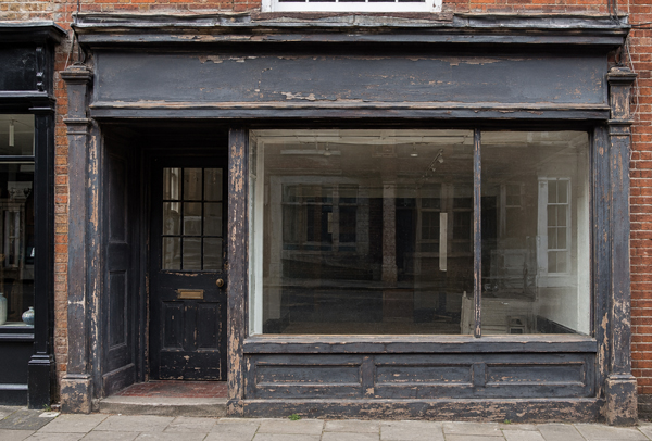 Traditional timber shop front before renovation in Sandy