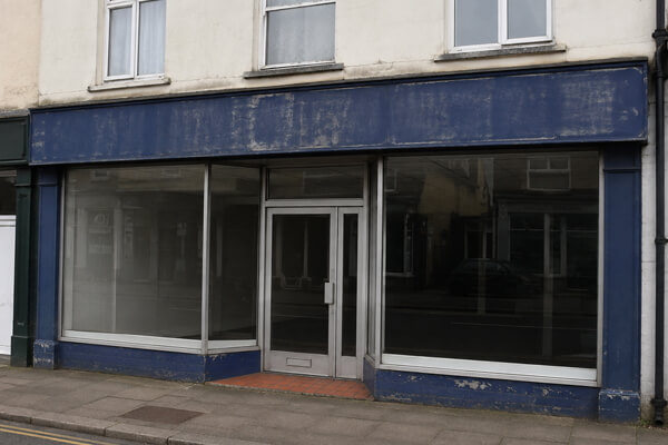 Dated shop frontage before professional spraying in Letchworth Garden City