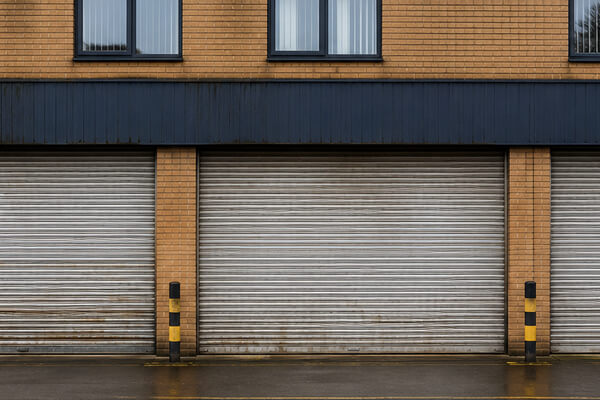 Commercial property shutter door before maintenance painting in Flitwick