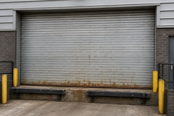 Loading bay shutter door before painting in Flitwick