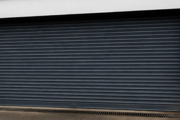 Warehouse roller shutter door after painting in Flitwick