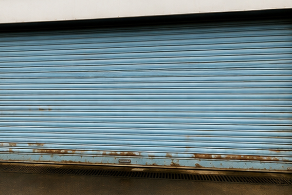 Warehouse roller shutter door before painting in Flitwick