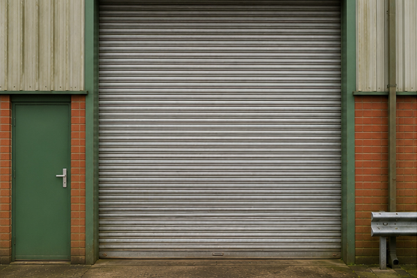 Roller shutter door before matching surrounding cladding in Wolverton
